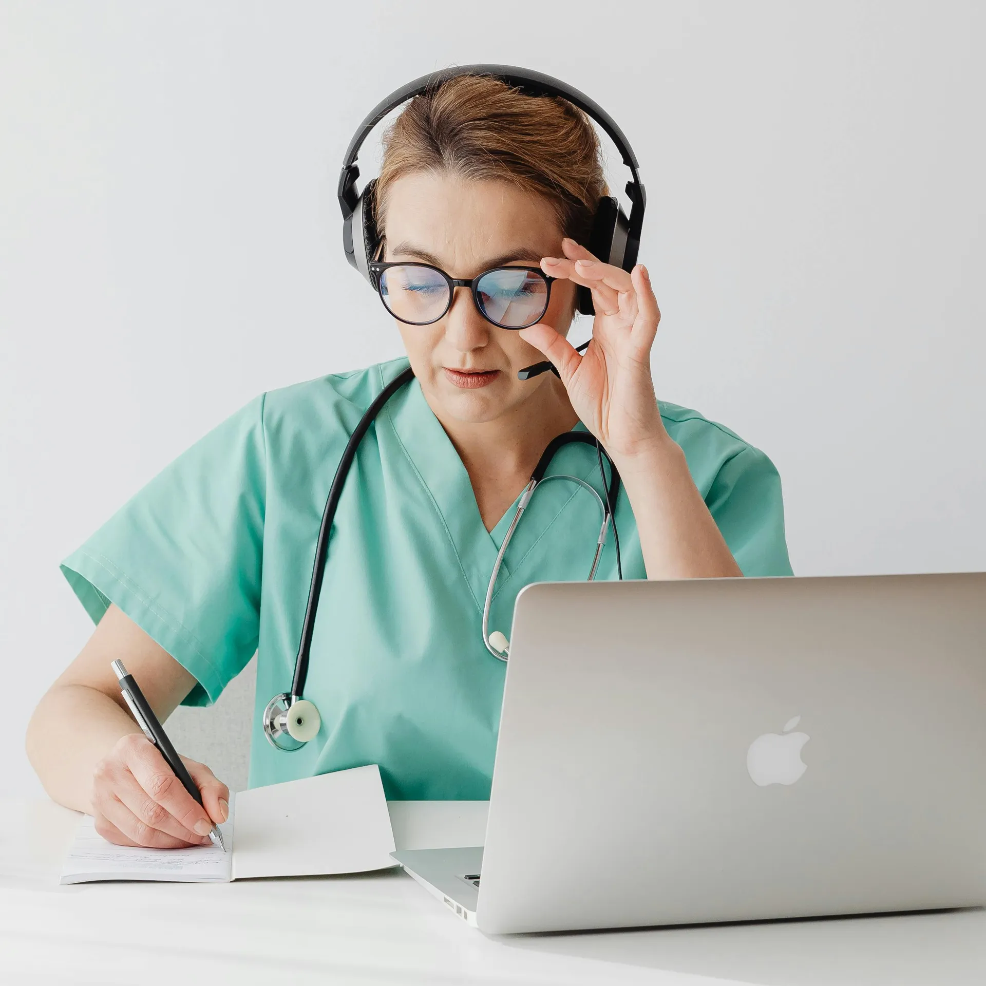 Provider with tablet reviewing patient information